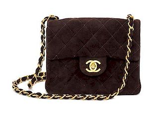 A Chanel Brown Suede Quilted Mini Flap Bag, 6.5" x 5" x 2.5".