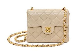 A Chanel Cream Calfskin Leather Small Flap Handbag, 6.5" x 5.5" x 2.5".