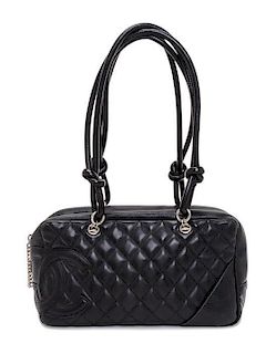 A Chanel Black Quilted Leather Ligne Cambon Bowler Bag, 11" x 6" x 4".