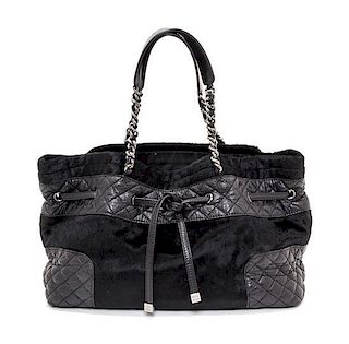 A Chanel Black Pony Hair Drawstring Tote Bag, 14" x 9" x 5".