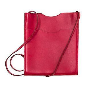 An Hermes Rouge Leather Passport Pouch, 7" x 8" x 1".
