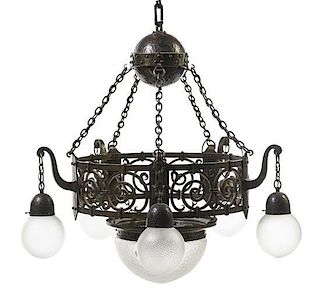 An Arts and Crafts Hammered Copper and Iron Chandelier, Diameter 34 inches.