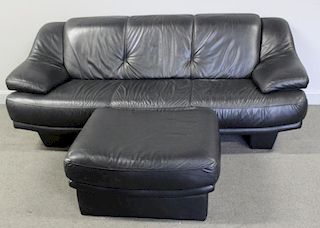 Contemporary Leather Upholstered Sofa and Ottoman.