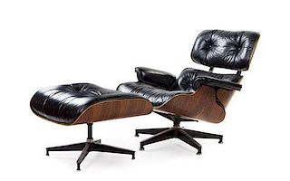 * A Charles and Ray Eames Rosewood 670 Lounge Chair and 671 Ottoman, Height of chair 31 1/2 inches.