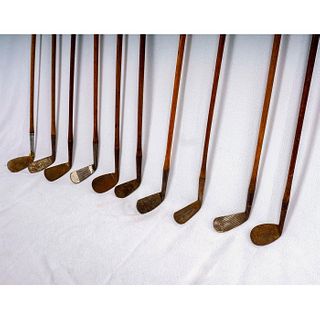 Set of Ten Iron Golf Clubs with Wood Shafts