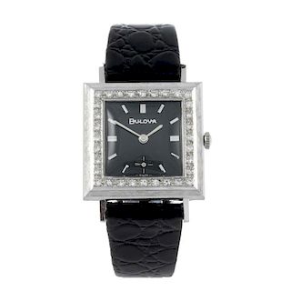 BULOVA - a wrist watch. White metal case with white stone set bezel, stamped 14kt. Numbered 044231.
