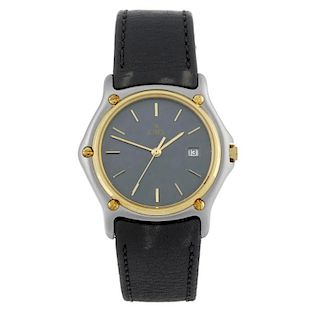 EBEL - a mid-size wrist watch. Stainless steel case with yellow metal bezel. Reference 183909, seria