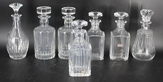 7 Baccarat Glass Lidded Decanters.