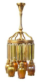 A Tiffany Studios Gold Favrile Glass and Dore Bronze Chandelier, Height 34 1/2 x width at widest 15 inches.