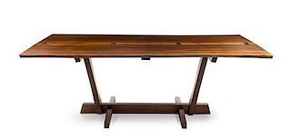 * A Mira Nakashima Walnut and Rosewood Conoid Dining Table, Height 28 3/4 x width 83 3/4 x depth 42 3/4 inches.