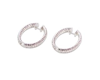 A pair of diamond and pink sapphire hoop earrings