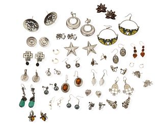 A large group of earrings