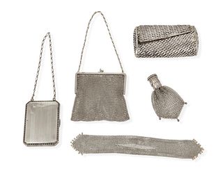A group of silver clutches/purses