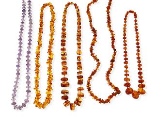 A group of bead necklaces
