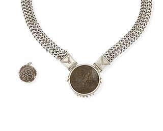 An antique coin necklace and charm