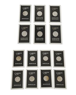 Fourteen United States Morgan silver dollars