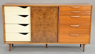 Harvey Probber credenza with burled sliding doors and bank of five exterior drawers having four interior drawers and three shelves, ...