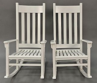 Pair of white porch rockers.