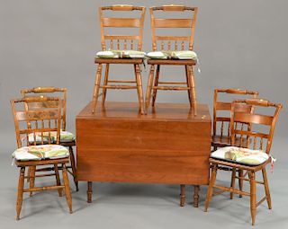 Cherry drop leaf table and six side chairs, signed Hitchcock. table: ht. 29 in.; top closed: 27" x 42", top open: 68" x 42"