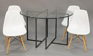 Contemporary dinding table with four Saarinen style chairs. ht. 30 in.; dia. 48 in.