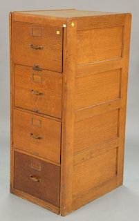 Four drawer oak file cabinet, ht. 52 in.; wd. 20 in.; dp. 26 in.