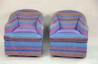 Vintage swivel club chairs with blue striped fabric.