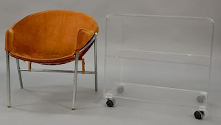 Leather sling chair and lucite table.