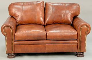 Braddington three piece leather set including two loveseats and an ottoman. loveseats: lg. 60 in.