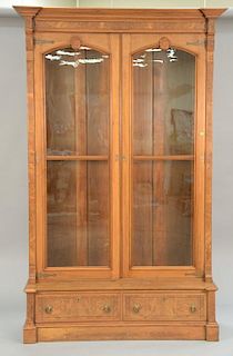 Victorian walnut and burl walnut two door bookcase with two drawer base. ht. 95 in.; wd. 56 in.; dp. 19 1/2 in.