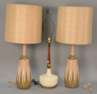 Three modern ceramic lamps including a pair of pink and brown with shades and a walnut and ceramic lamp.