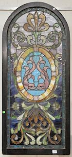 Leaded stained glass window, lighted in back. 53" x 24"