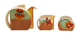 A Clarice Cliff Bizarre Ware Pottery Tea Set, Height of teapot 4 3/4 inches.