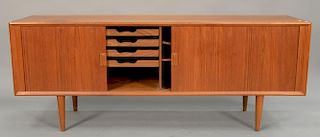 Modern teak sideboard with two tambor doors revealing fitted drawers and shelf interior, attributed to Yngve Ekstrom. ht. 32 in.; wd...