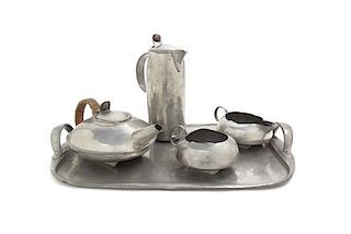A Tudric Pewter Tea and Coffee Service, Archibald Knox for Liberty & Co., Height of tallest 9 1/2 inches.