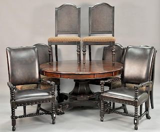 Mahogany pedestal table with star inlay center and five surrounding extensions. closed: dia. 59 in.; open: dia. 80 in.