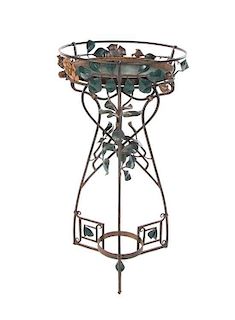* A Transitional Art Nouveau/ Art Deco Iron Jardinere Stand, Height 46 x diameter 24 1/4 inches.