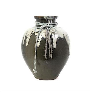 A Japanese Black Mottled Glaze Tea Vessel, Height 20 1/2 inches.