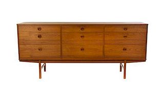 * A Folke Ohlsson Teak Chest of Drawers, for Dux, Height 31 1/2 x width 71 1/2 x depth 18 3/8 inches.