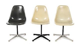 * Three Charles and Ray Eames Fiberglass PSC Chairs, Height 31 3/8 inches.