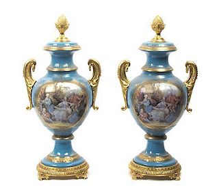 A Pair of Continental Porcelain Covered Urns, Height 19 inches.