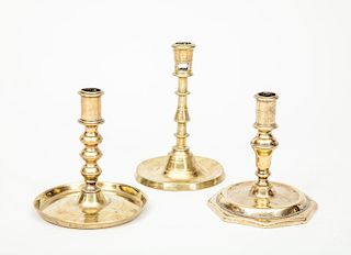 French Baroque Bell Metal Candlestick, a Flemish Brass Candlestick, and a Spanish Brass Stick