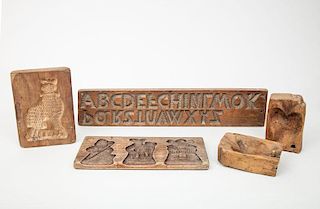 French Intaglio Carved Walnut Alphabet Mold, a Cat Mold, a Figure and Windmill Mold and a Two-Part Heart Mold