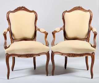Pair of Louis XV Style Carved Walnut Fauteuils en Cabriolet