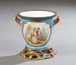 Diminutive French Bronze Mounted Sevres Cachepot, 19th c., in heavenly blue, with a beaded bronze rim over a painted reserve of a couple in a garden, 