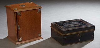 Two Antique Boxes, 19th c., one an American polychromed tole cash box; the second a carved metal mounted oak pipe cabinet, with an interior upper draw