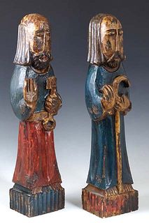 Pair of Polychromed Carved Wood Figures of Saints, 19th c., on an integral reeded rectangular wood base, H.- 17 in., .- 3 3/4 in., D.- 2 7/8 in.