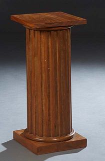 Carved Cypress Pedestal, 20th c., the square top over a reeded column support, to a square base, H.- 29 7/8 in., W.- 13 in., D.- 13 in.
