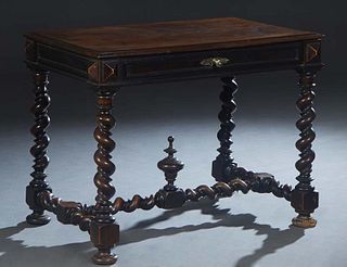 French Louis XIII Style Carved Oak Writing Table, 19th c., the stepped rounded edge top over a long frieze drawer, on rope twist trestle supports join