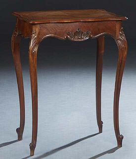 French Louis XV Style Carved Walnut Work Table, early 20th c., the crotched stepped lifting tortoise lid with an interior beveled mirror, above three 