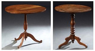Two French Louis Philippe Carved Walnut Tilt Top Tables, 19th c., the circular tops on turned vasiform supports to tripodal cabriole legs, H.- 28 1/2 